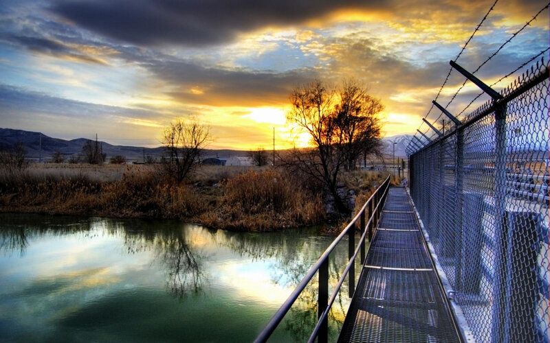 Metal Walkway over River — Yellow