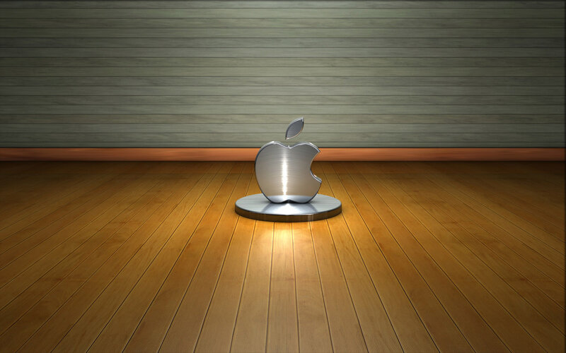 Metallic Apple logo on wood