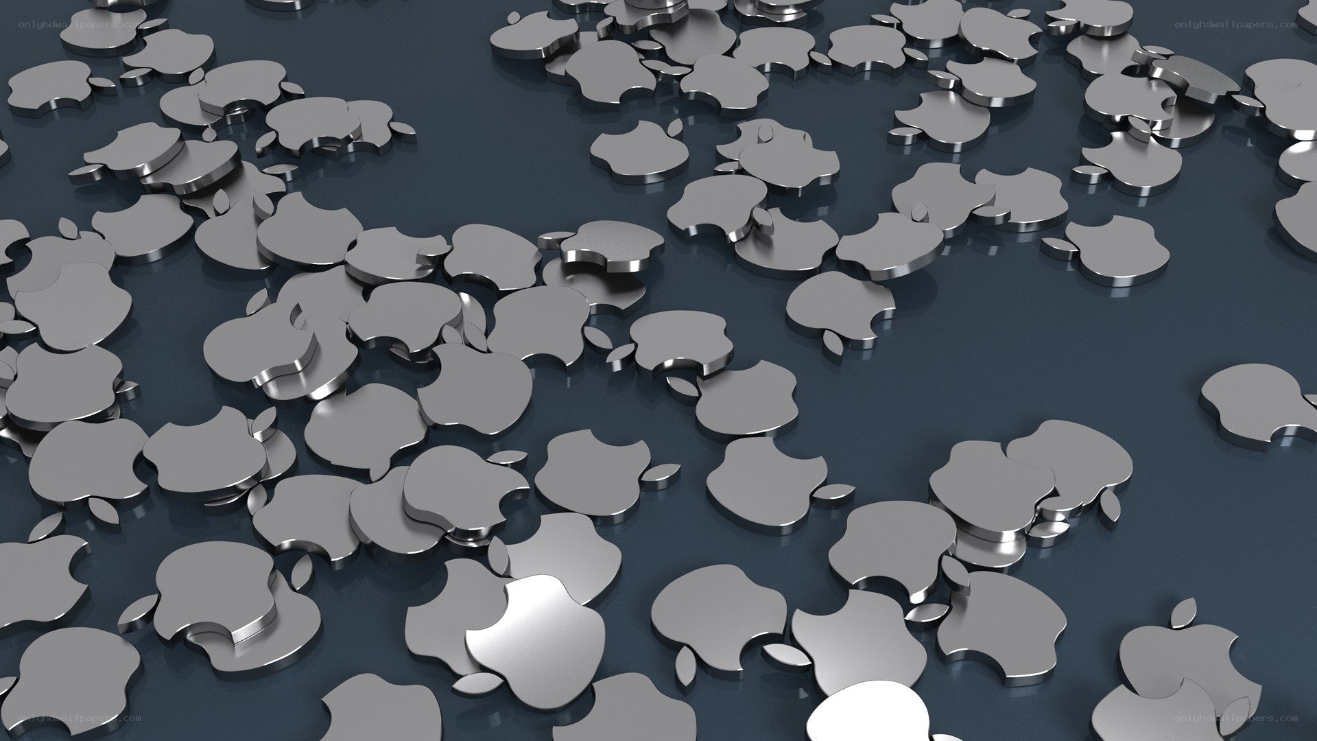 Metallic Apple logos scattered