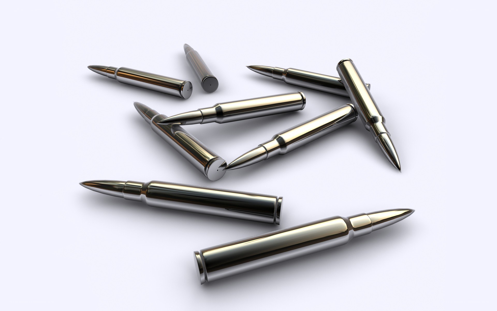 Metallic bullets on white surface