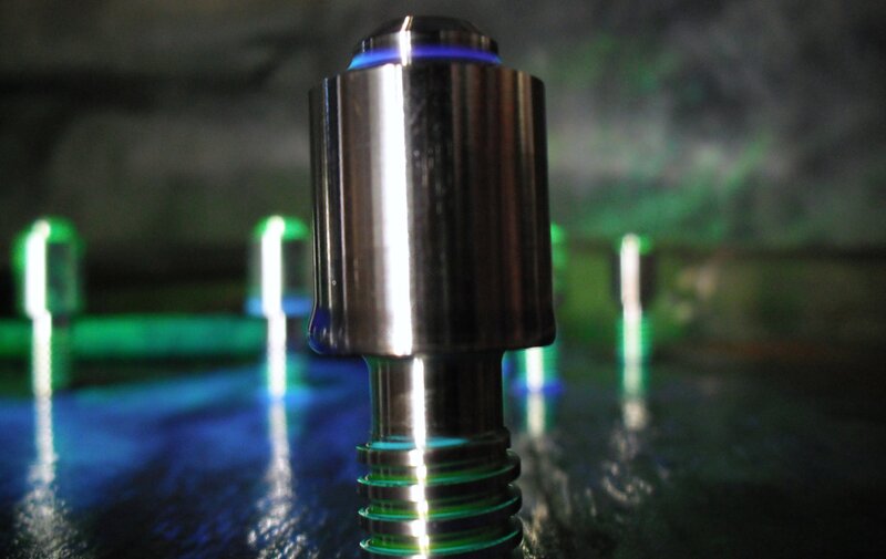 Metallic component with glowing lights