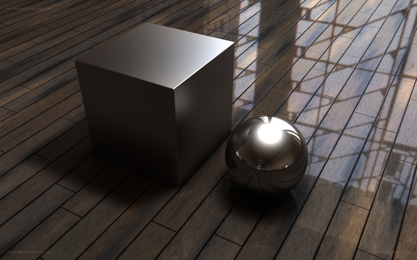 Metallic cube and sphere on wood
