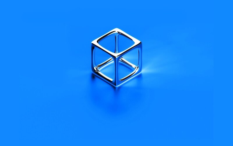 Metallic cube on blue