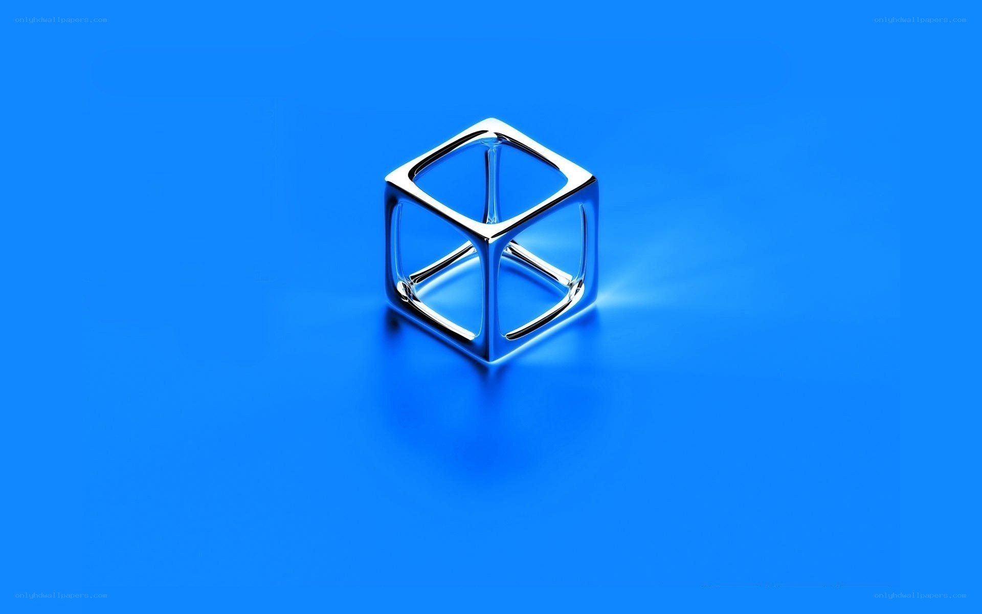 Metallic cube on blue