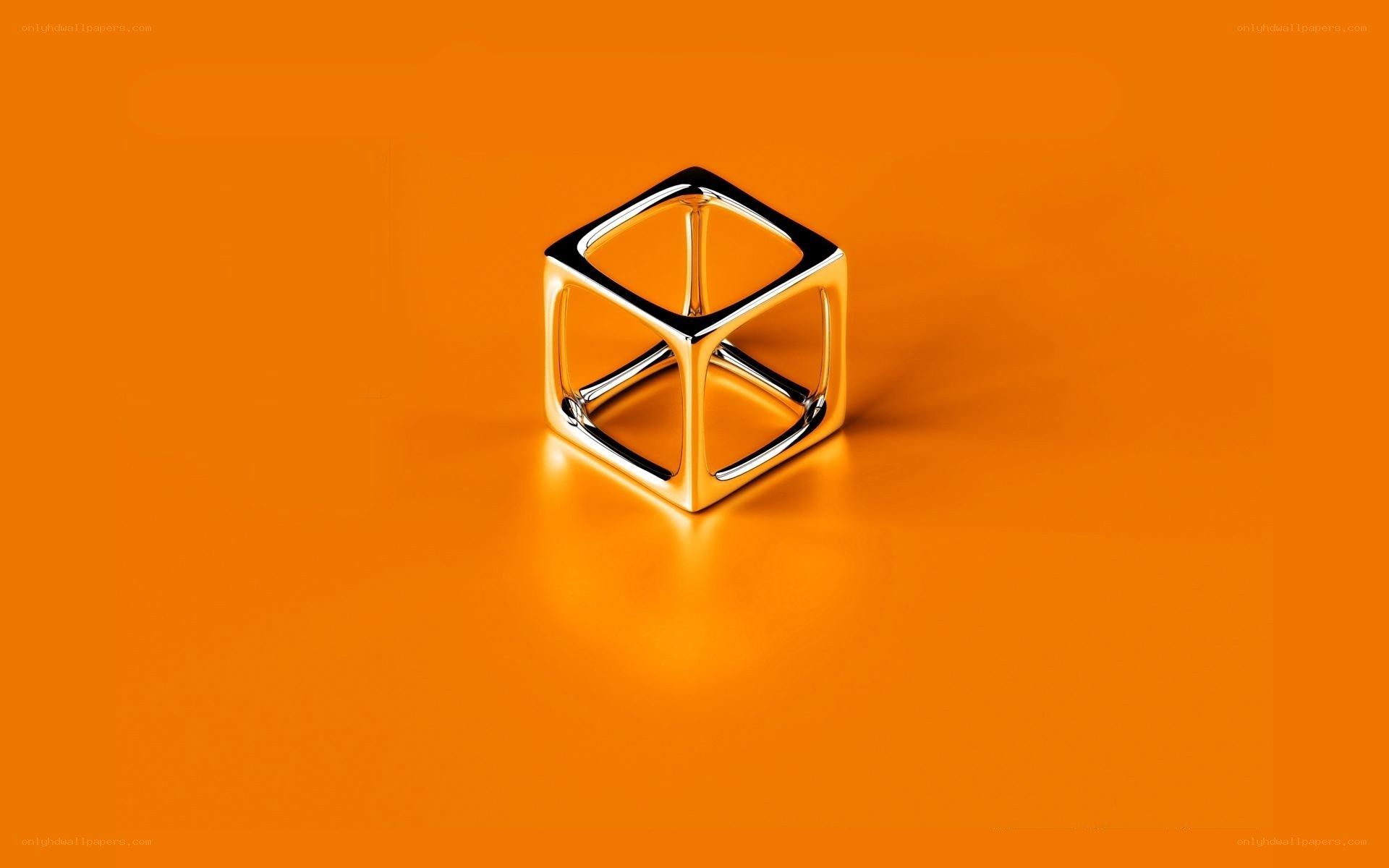 Metallic cube on orange background