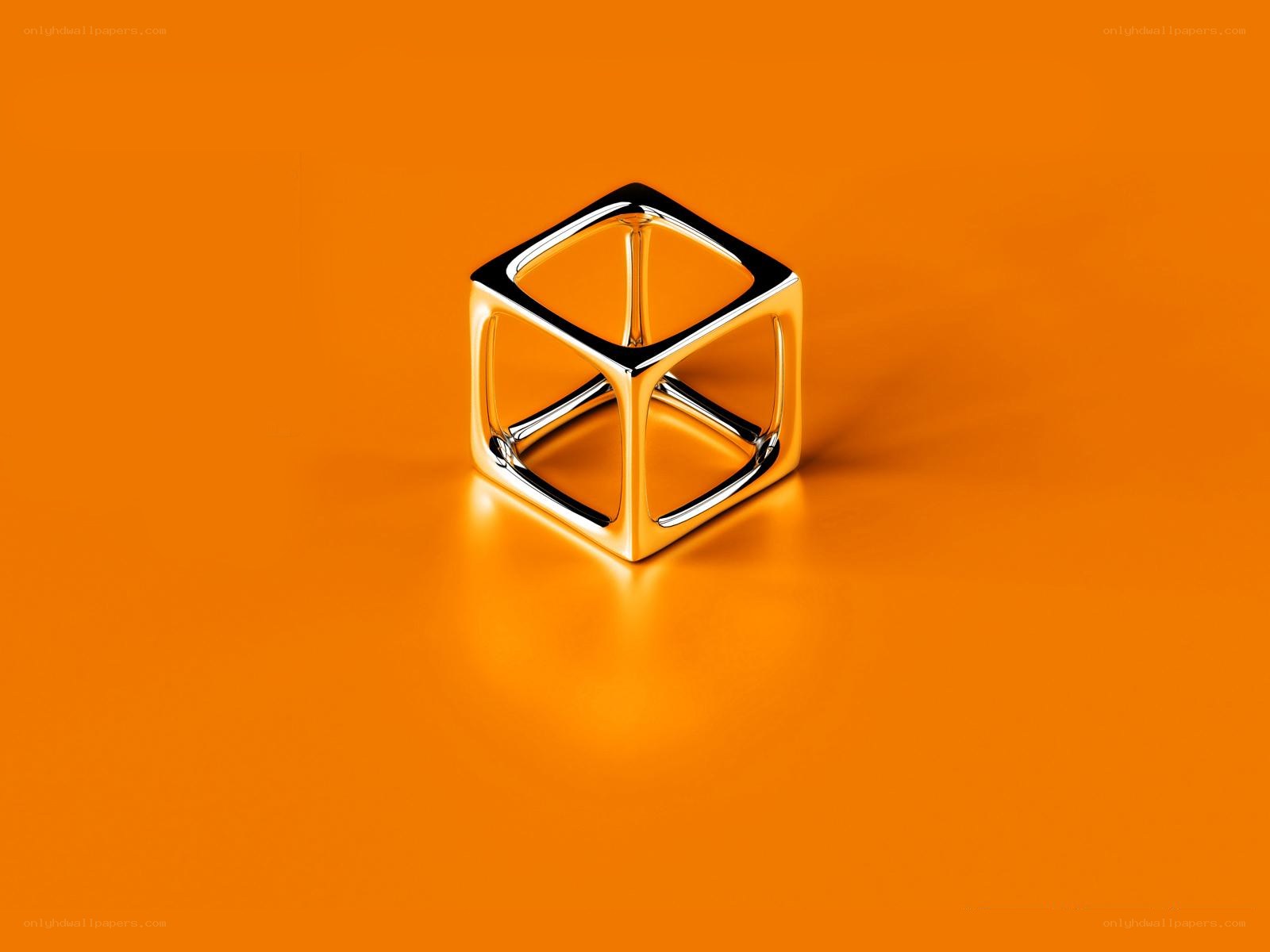 Metallic cube on orange surface