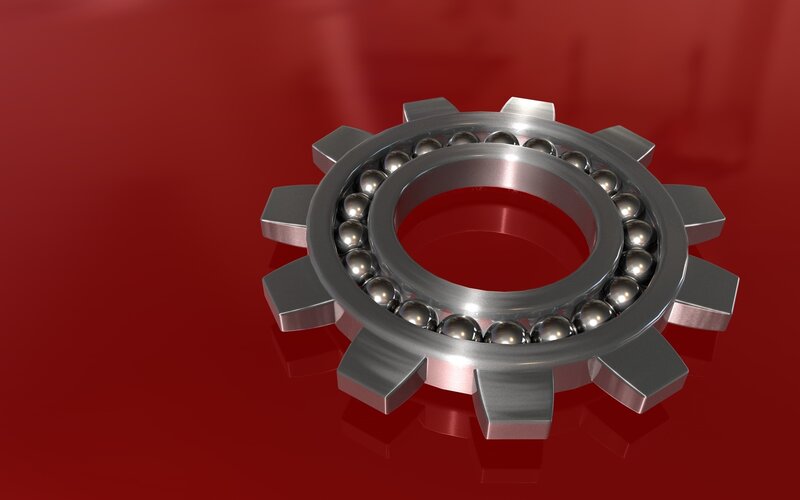 metallic gear bearing on red