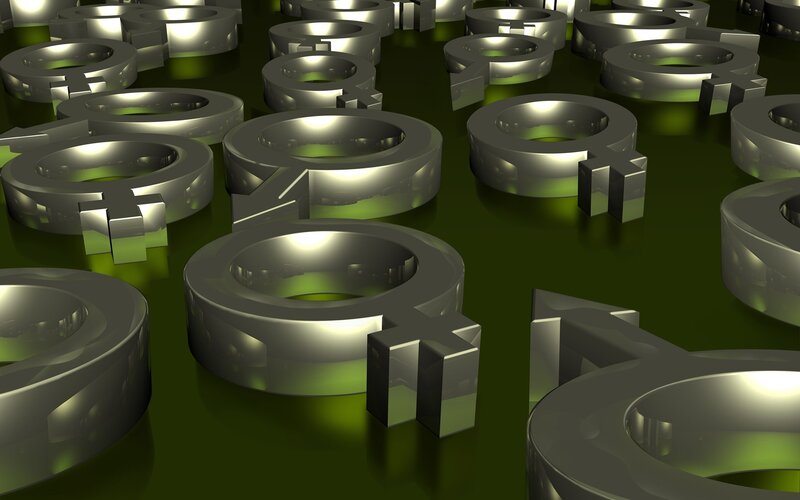 Metallic gender symbols on green