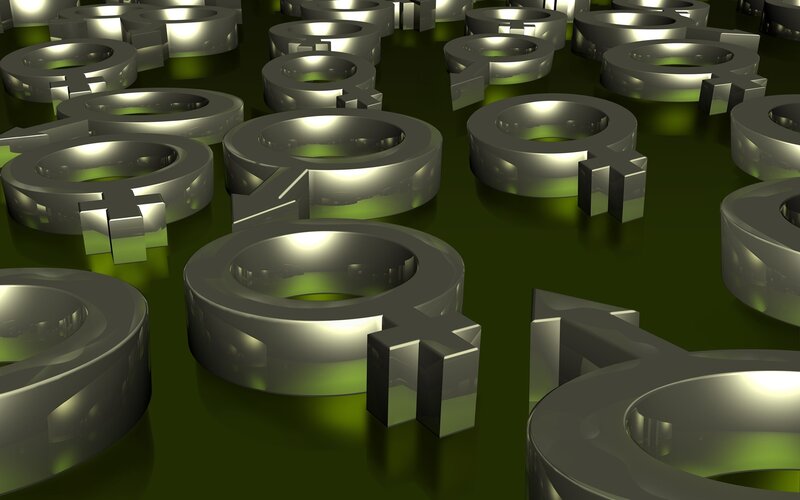 Metallic gender symbols on green