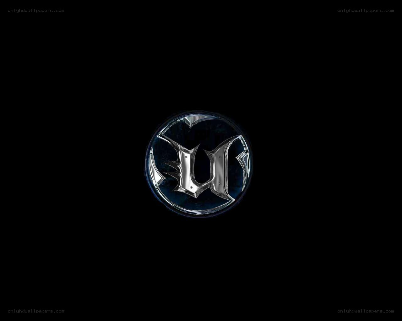 metallic logo on black background