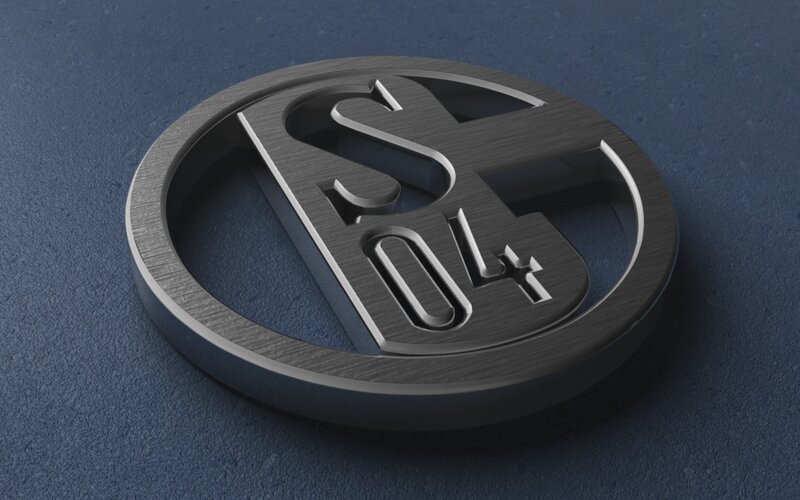 metallic logo on blue surface