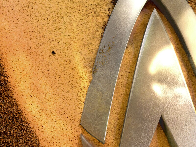 metallic logo on textured surface