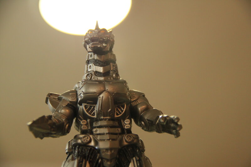 Metallic robot figure under spotlight