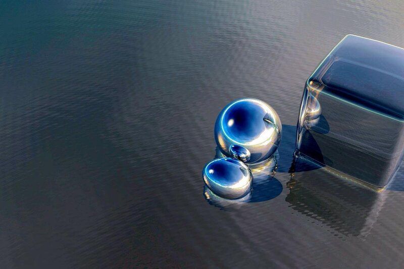Metallic spheres and cube on water