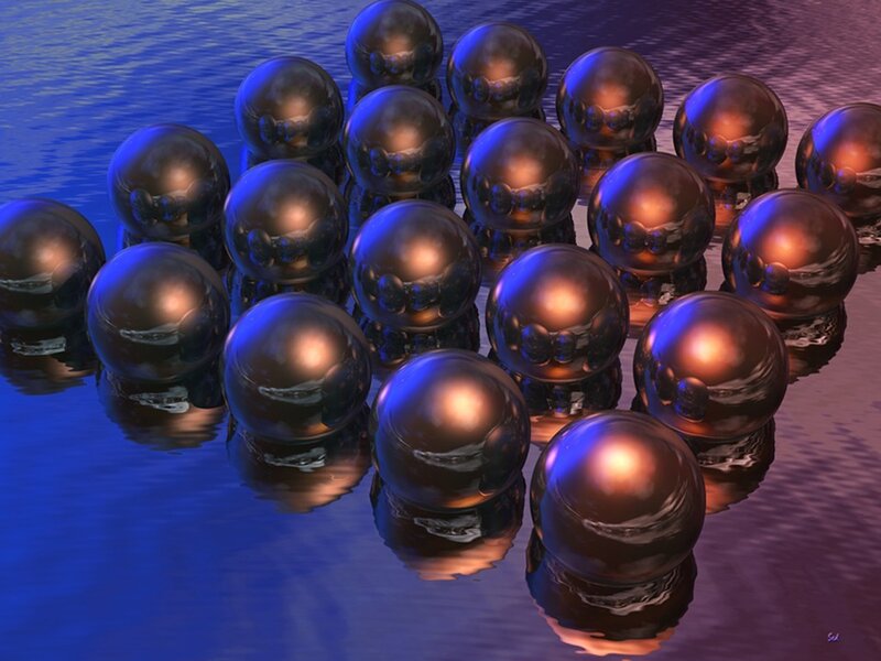 Metallic spheres on water
