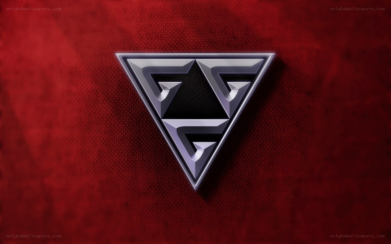 metallic triangle logo on red fabric