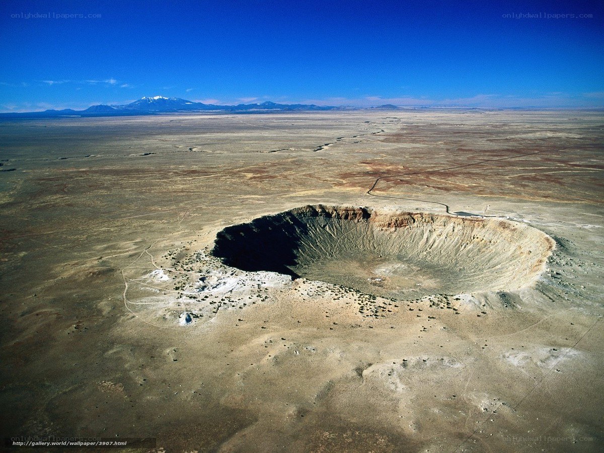 Meteor crater in desert landscape
