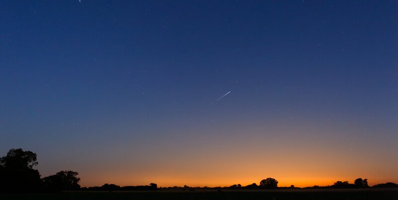 Meteor over a starry sky