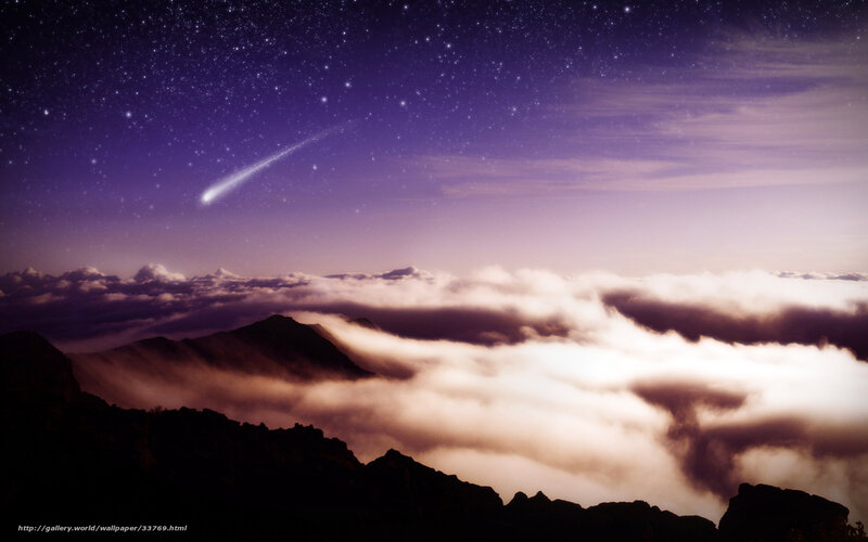 Meteor over mountain clouds