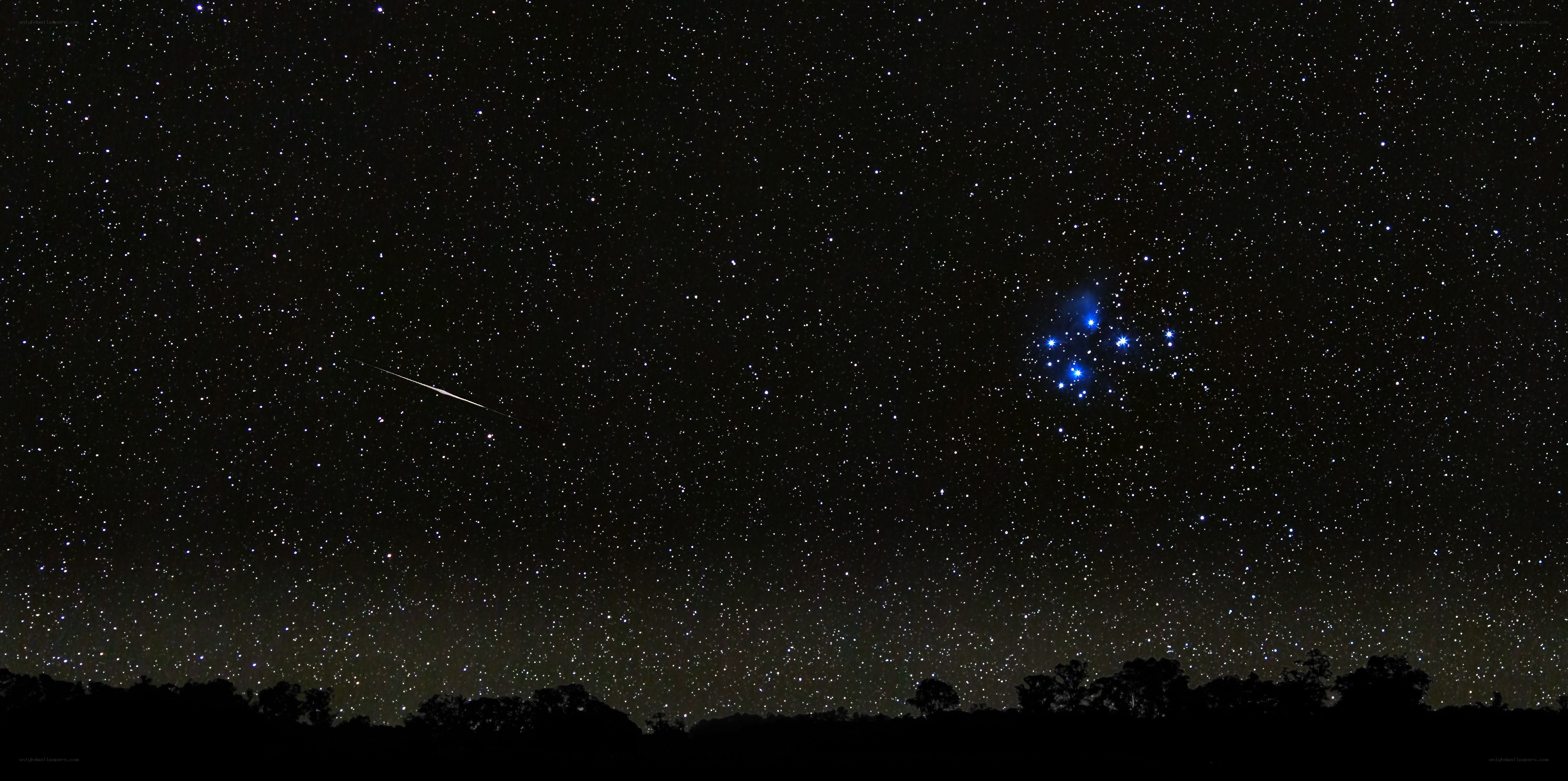 Meteor over starry sky