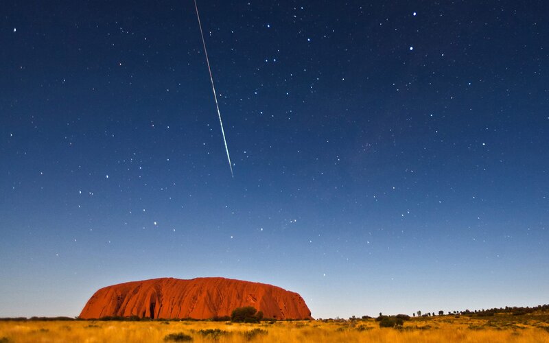 Meteor over Uluru at night