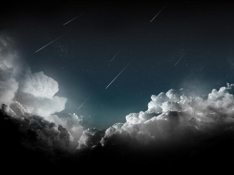 Meteor shower over clouds