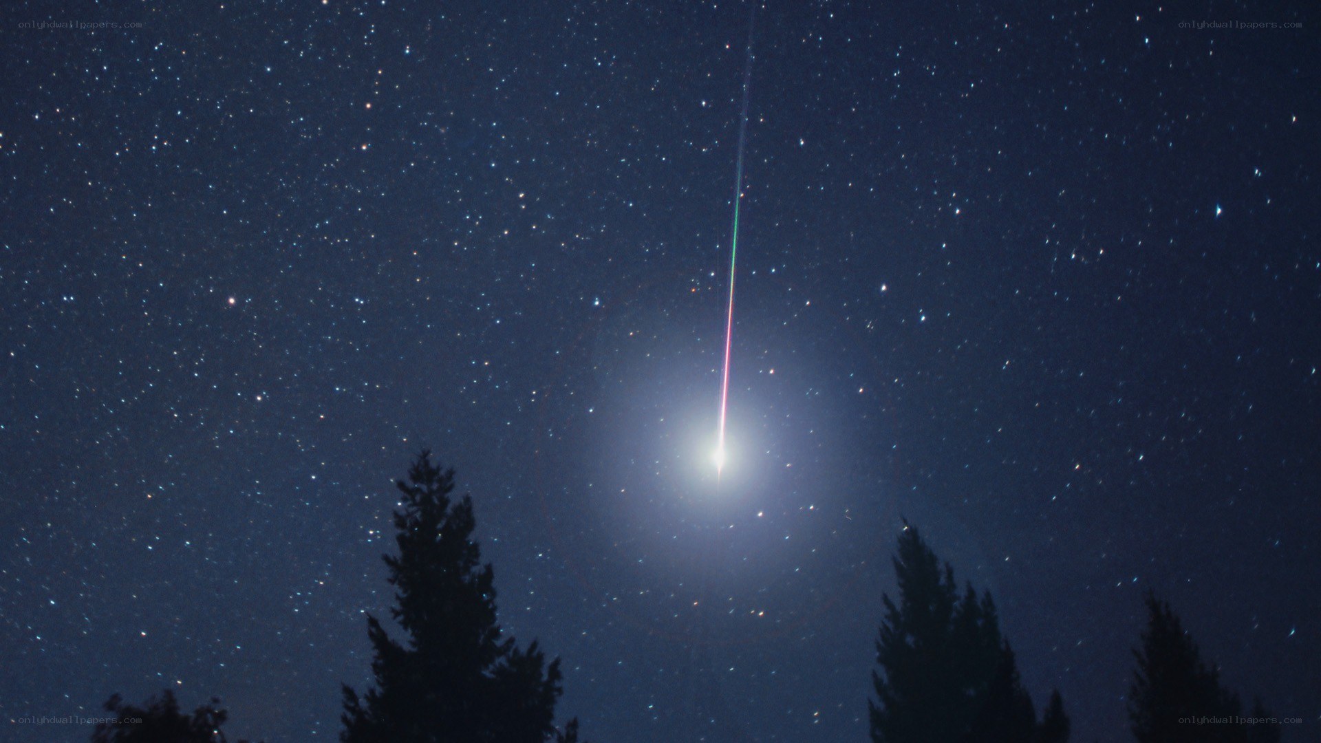 Meteor streaking across night sky
