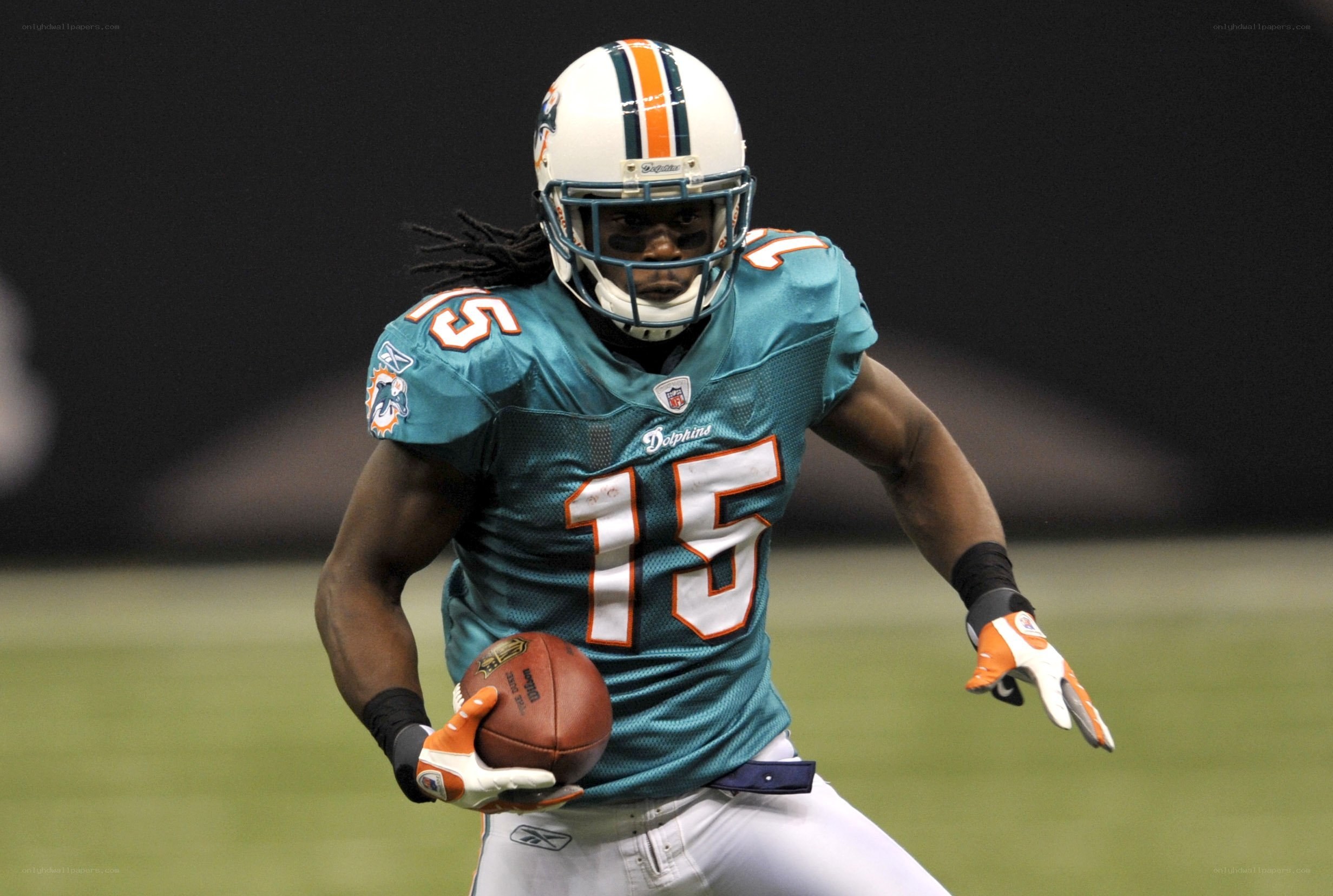 Miami Dolphins player running with ball