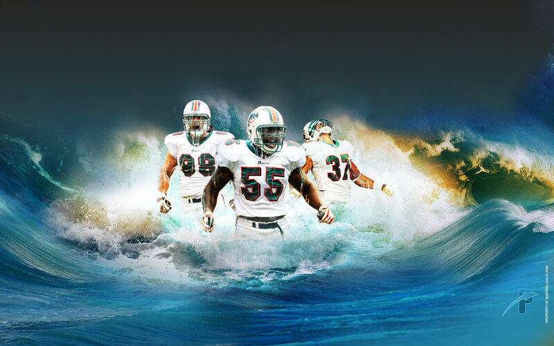 Miami Dolphins players in ocean waves