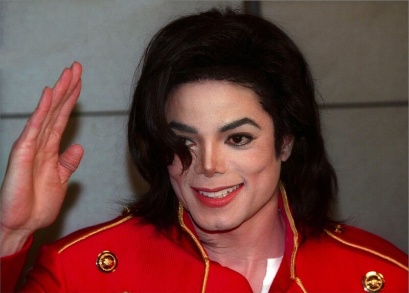 Michael Jackson waving in red jacket