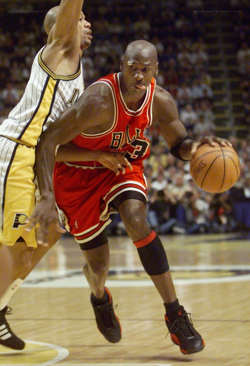 Michael Jordan dribbling against defender