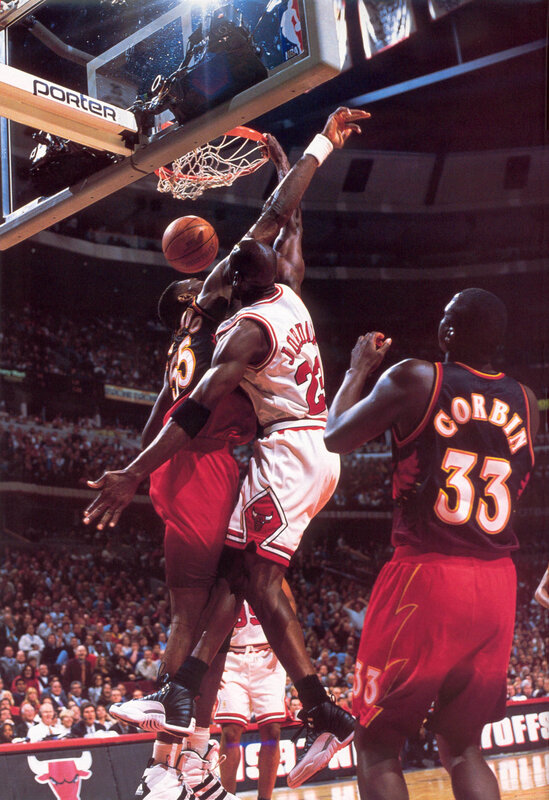 Michael Jordan dunks over defender