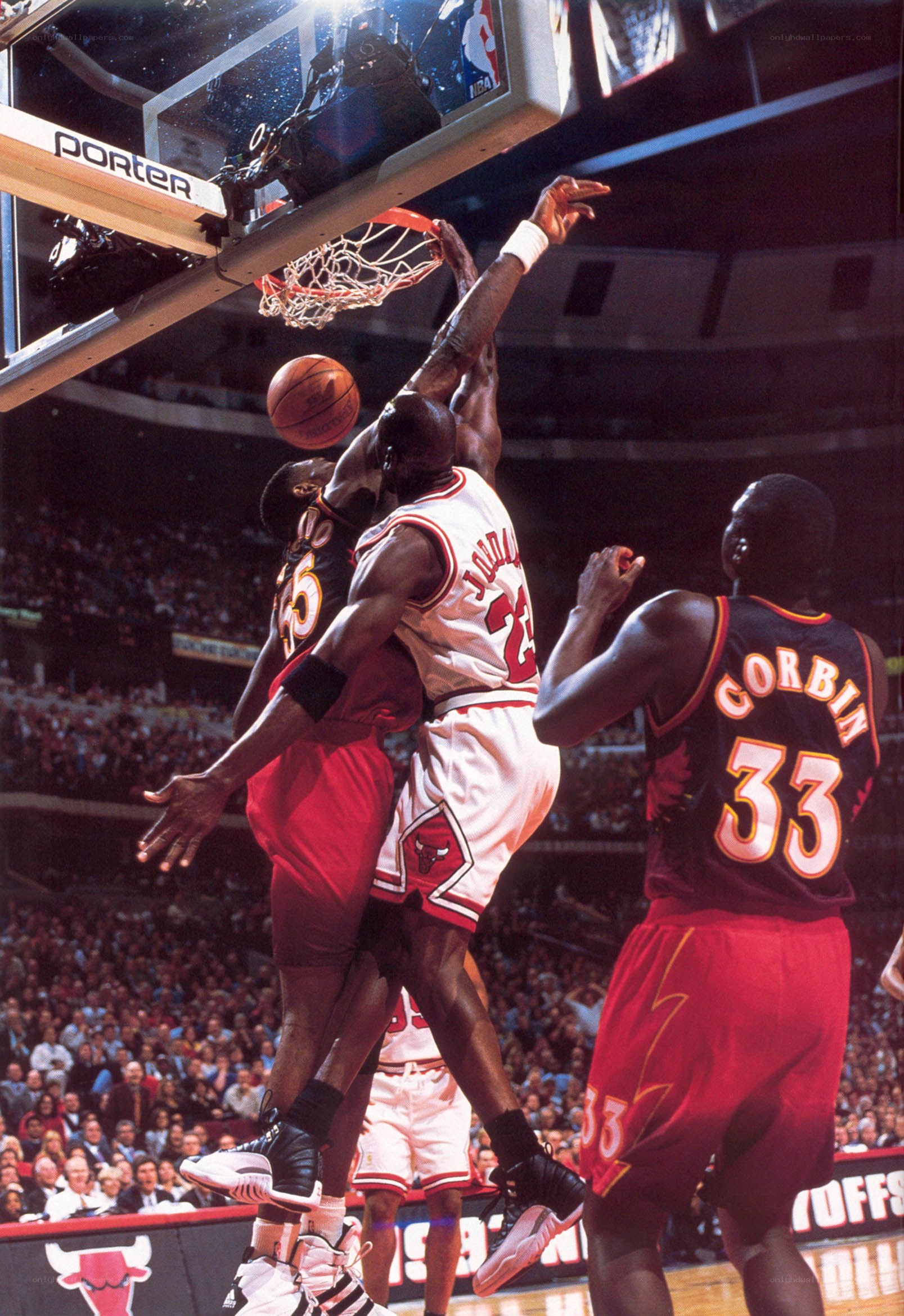 Michael Jordan dunks over defender