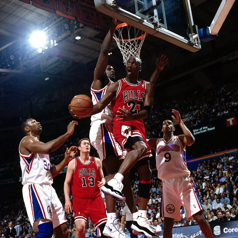 Michael Jordan dunks over defenders