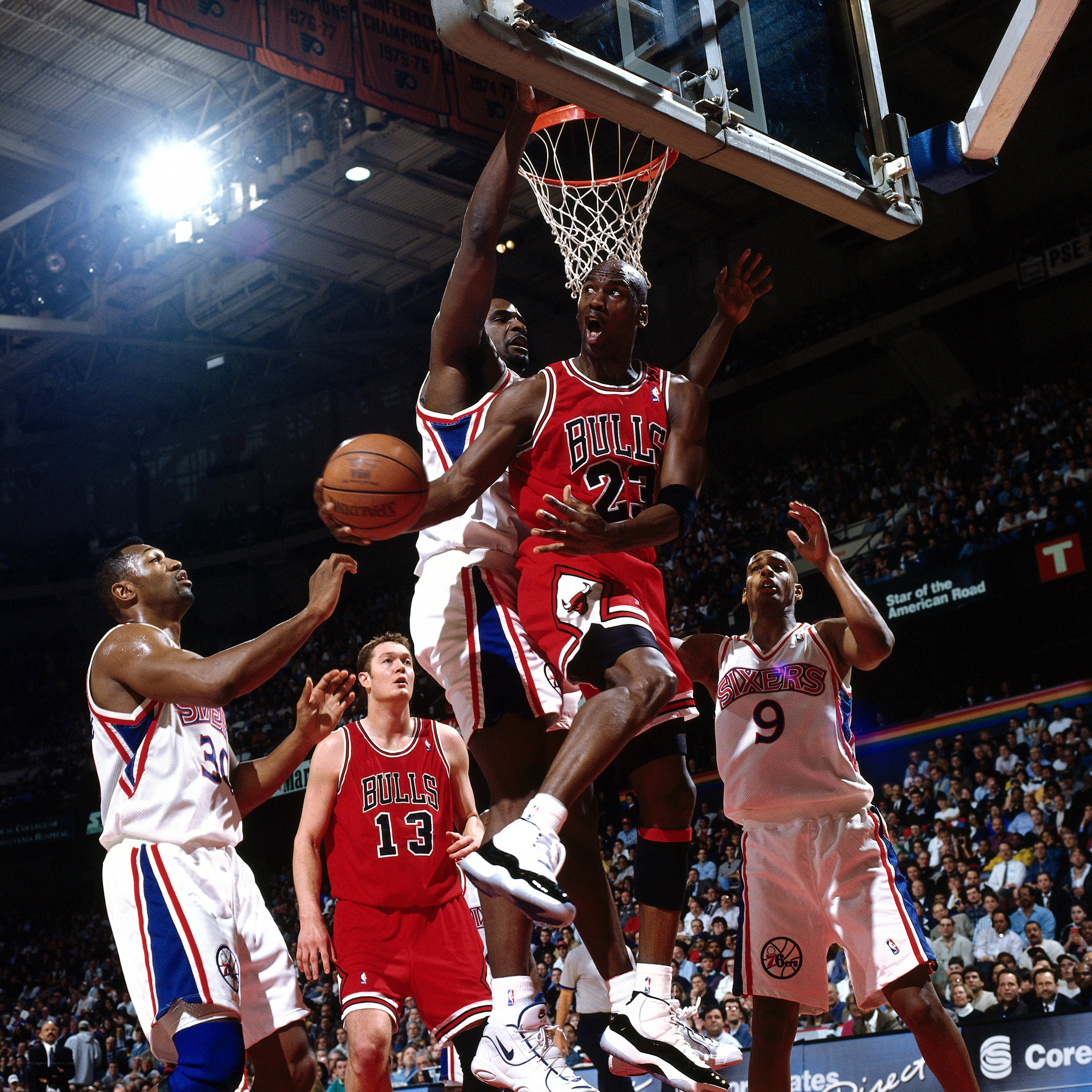 Michael Jordan dunks over defenders