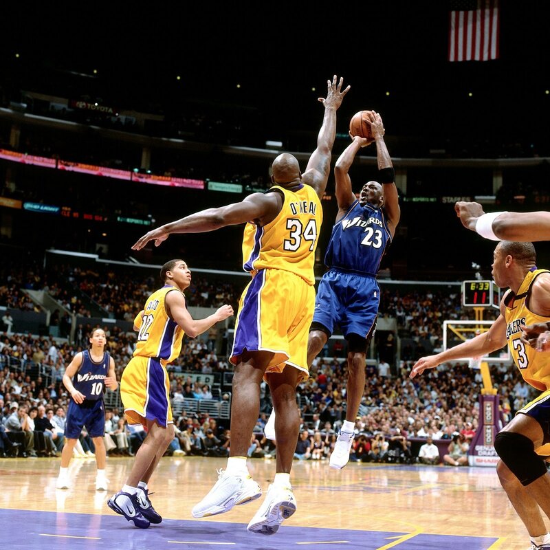 Michael Jordan shooting over Shaquille O'Neal