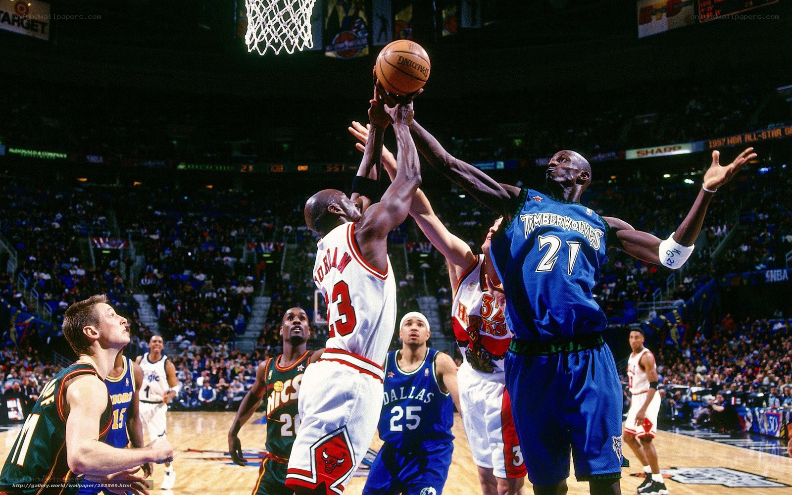 Michael Jordan shoots over a defender