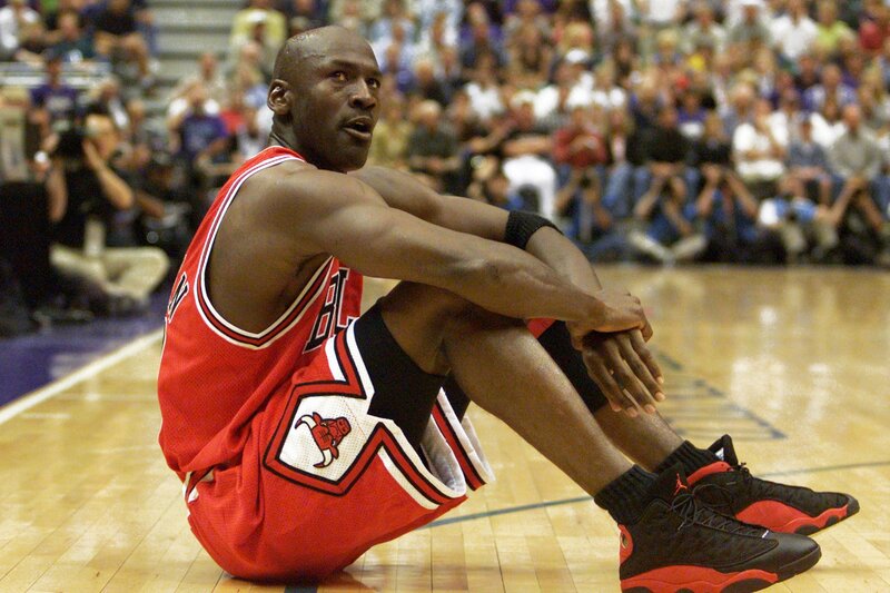 Michael Jordan sitting on court