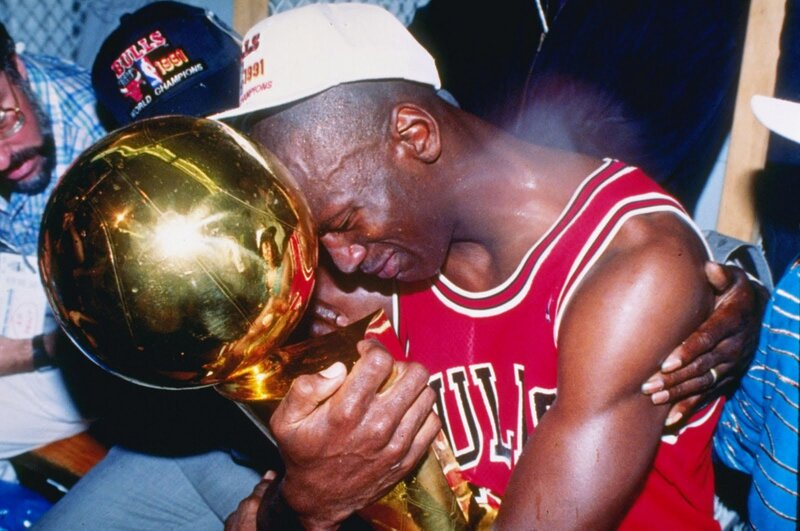 Michael Jordan with championship trophy