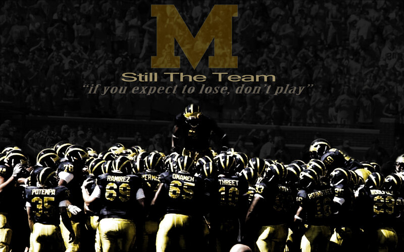 Michigan football team huddle