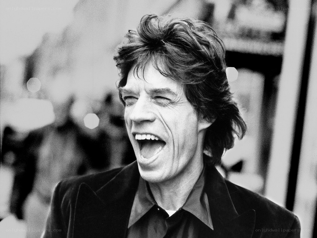 Mick Jagger laughing outdoors
