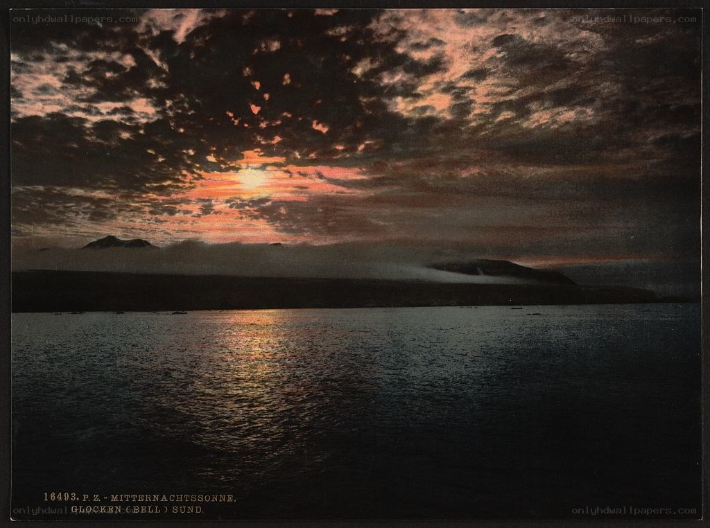 Midnight sun over a fjord