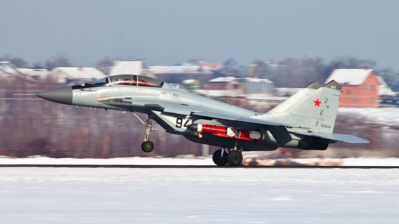 MiG-29 jet on snowy runway