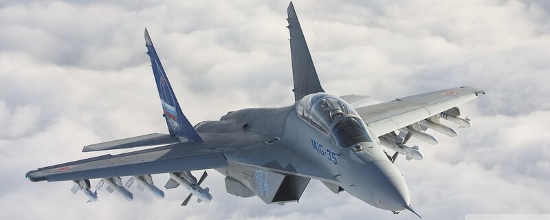 MiG-35 Fighter Jet — Gray, Dramatic, Photograph, Clouds, Missiles, Pilot