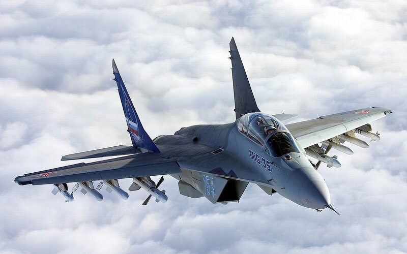 MiG-35 Fighter Jet — Gray, Dramatic, Photograph, Clouds, Missiles