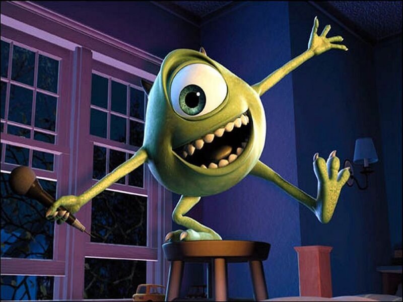 Mike Wazowski singing on a stool