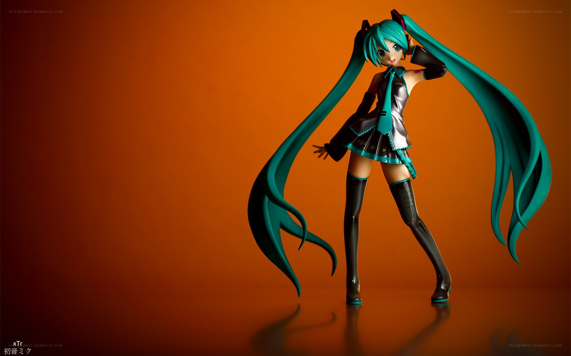 Miku figurine on orange background