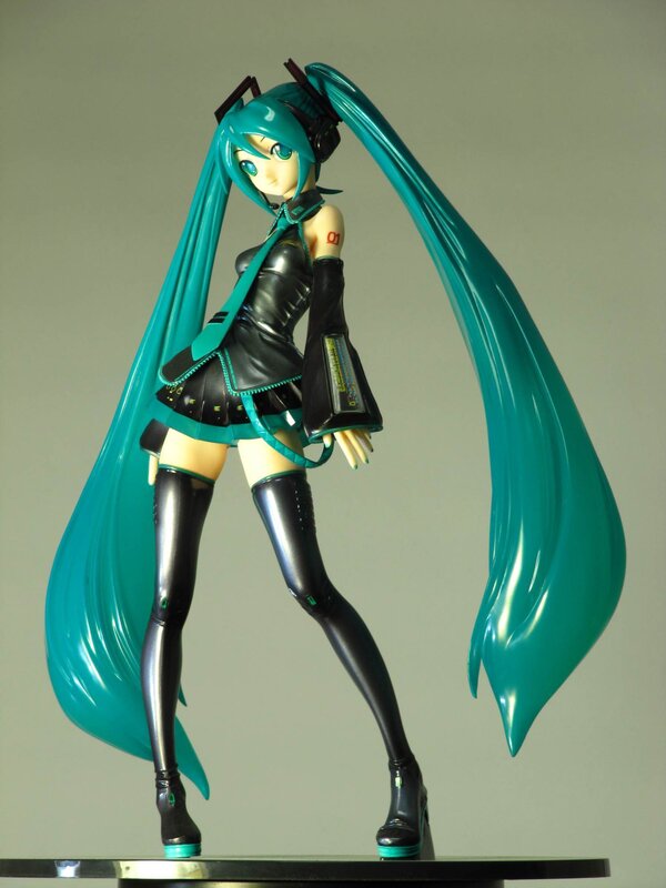 Miku figurine with long teal hair