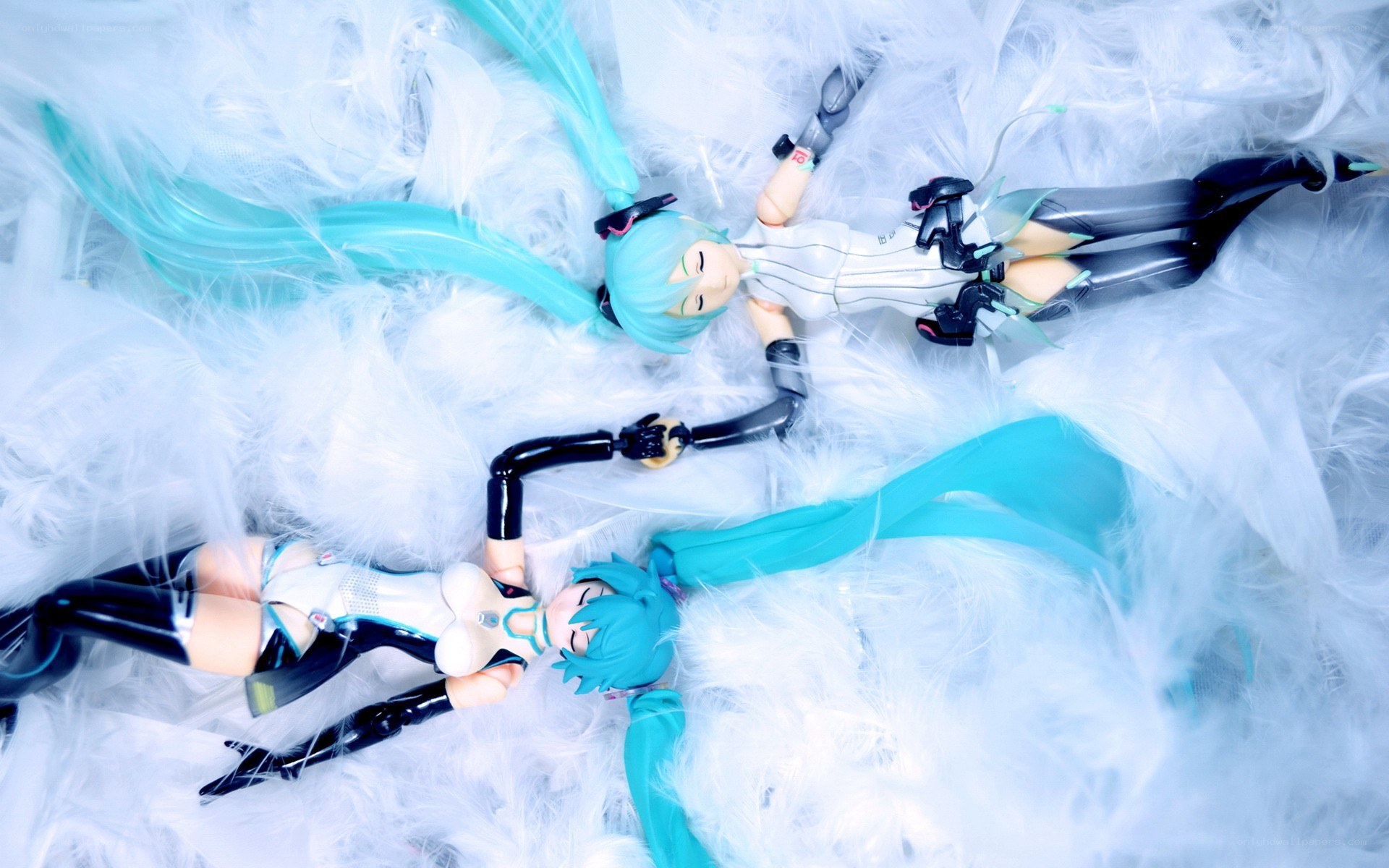 Miku figurines on feathers