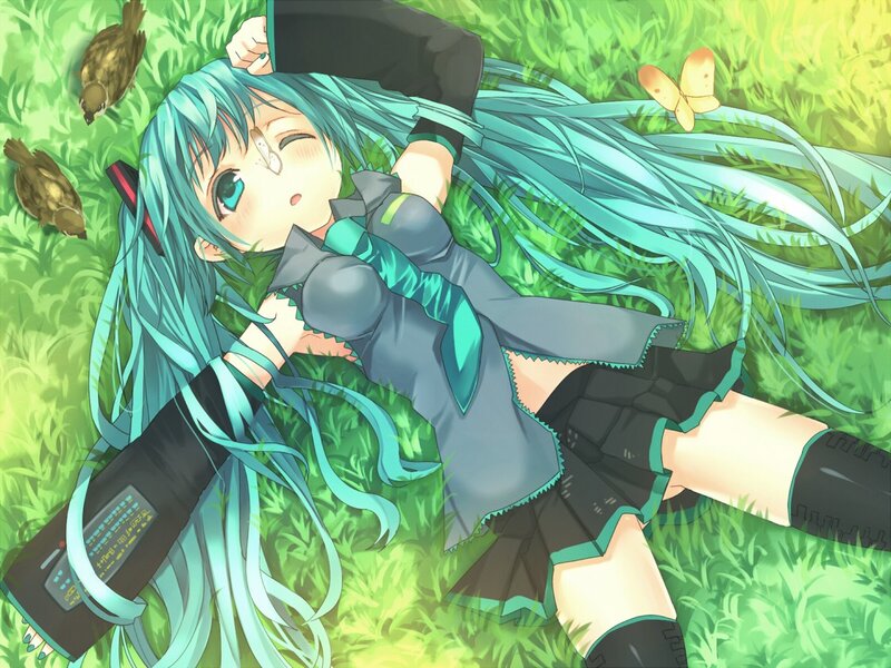 Miku lying in the grass